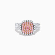 The 18K Two Tone Gold White and Pink Diamond Ring features a cushion-shaped cluster of pink diamonds at the center, encircled by a double halo of white diamonds, with more diamonds set along the band.