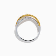 The Trio 18K Gold Pink, Yellow, and White Diamond Criss Cross Ring showcases three intertwined rows with pink, yellow, and white diamonds and elegant details, all set against a white background.