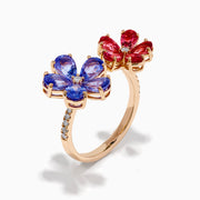 The 14K Rose Gold Tanzanite, Tourmaline and Diamond Floral Ring features two flower designs with tanzanite blue and pink tourmaline petals, each centered by a sparkling diamond, all set against a white background.