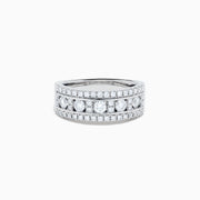 The 14K White Gold Channel Set Diamond Wide Band Ring features three rows of round diamonds, with five larger channel-set stones in the center and smaller diamonds on either side, creating an elegant, eye-catching look.