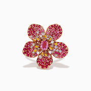 The Nature 14K Rose Gold Pink Sapphire and Diamond Flower Ring features a floral design with five petals, small pink and red gemstones, a central oval pink sapphire, and shimmering rose gold outlining for added sparkle.