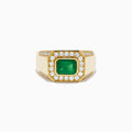 The Men's 14K Yellow Gold Emerald Signet Ring features a rectangular green emerald center, double diamond halo, and side diamonds along the band.