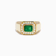 The Men's 14K Yellow Gold Emerald Signet Ring features a rectangular green emerald center, double diamond halo, and side diamonds along the band.