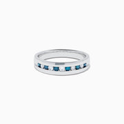 The Mens Bella Bleu 14K White Gold White and Blue Diamond Ring features alternating blue and white diamonds set in a channel across the top, displayed on a plain white background.
