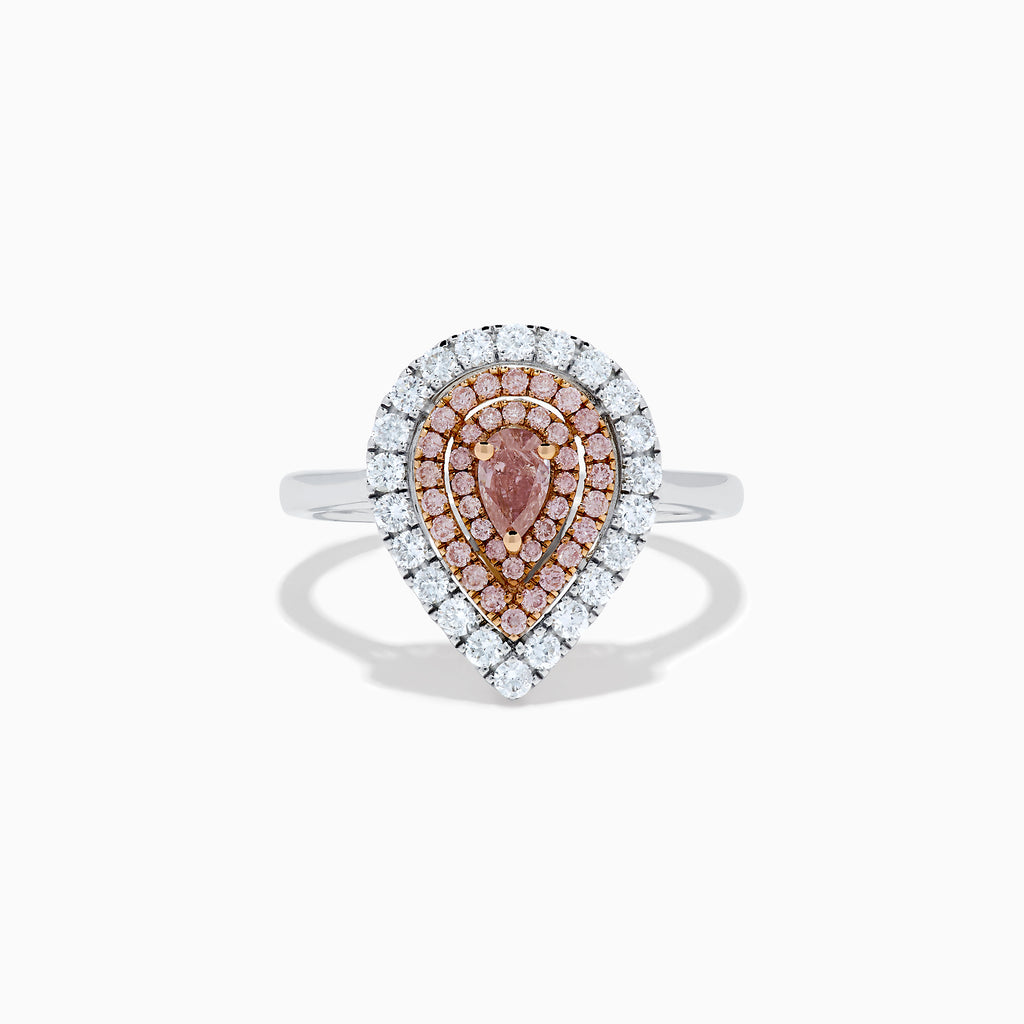 The 18K Two Tone Pear Shape Pink and White Diamond Halo Ring showcases a pear-shaped center, double halos of pink and white diamonds, and a slim two-tone band, set against a white background.