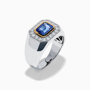 The Men's 14K Two Tone Gold East West Emerald Cut Tanzanite and Diamond Ring features a rectangular blue tanzanite set in a gold bezel, framed by white diamonds, all beautifully crafted against a plain white background.