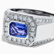 The Men's 14K White Gold East West Tanzanite and Diamond Signet Ring features a rectangular tanzanite center set among round diamonds in a bold geometric design, showcased on a white background.