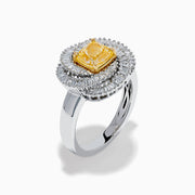 The 14K Two Tone Yellow Gold Yellow and White Diamond Halo Spiral Ring features a central square yellow gemstone, surrounded by a diamond halo with two rows of white diamonds in a sparkling circular spiral design.