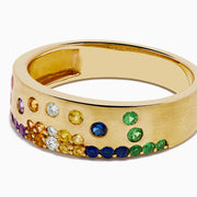 The Watercolors 14K Yellow Gold Multi Sapphire and Diamond Scattered Ring showcases vibrant sapphires in red, yellow, green, blue, and purple hues set across the gold band.