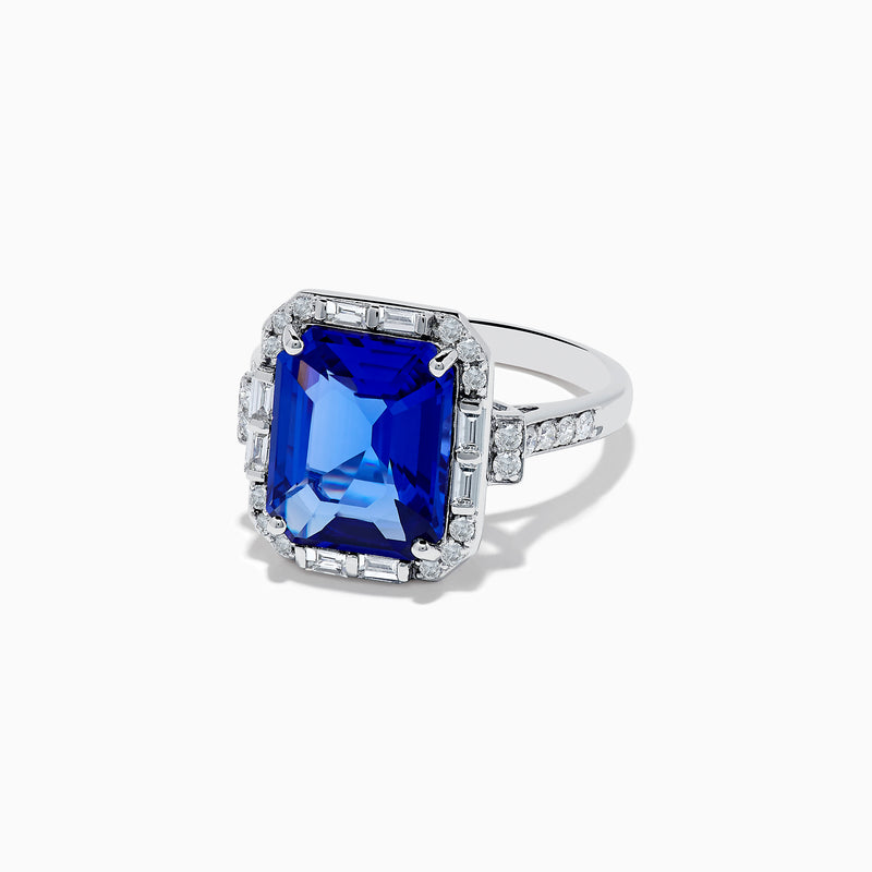 The Nahla Siri 14K White Gold Emerald Cut Tanzanite and Diamond Ring features a large emerald-cut tanzanite center, accented by baguette and round diamonds, displayed on a white background.