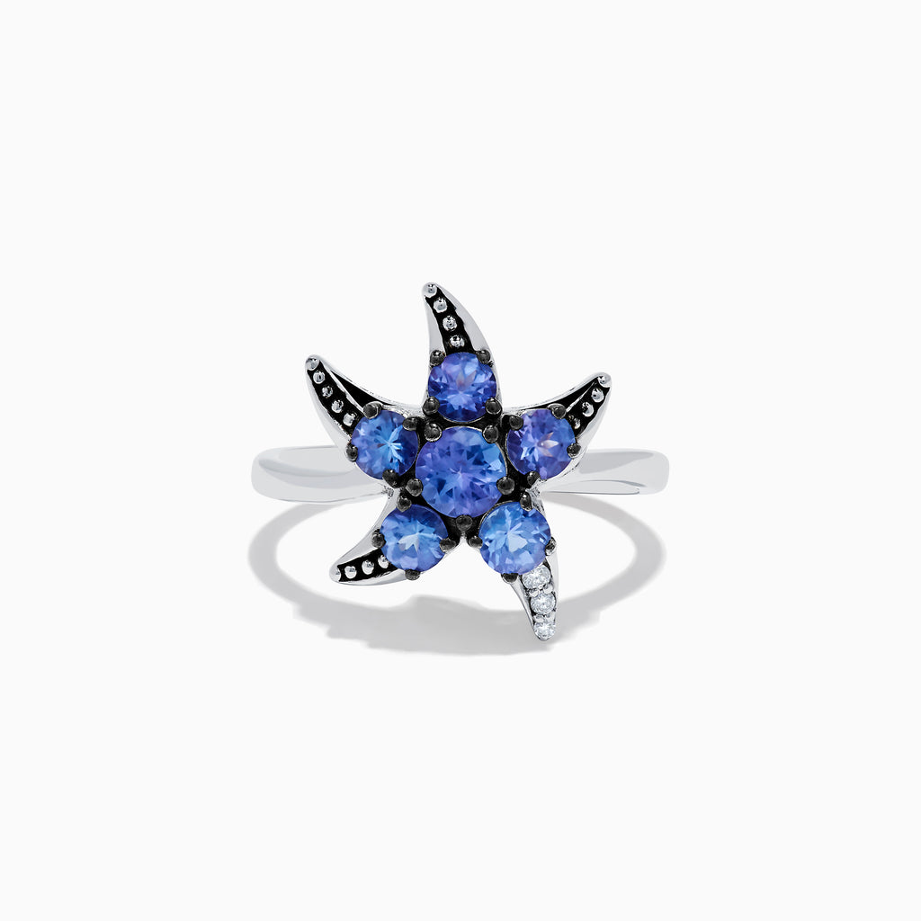 The 925 Sterling Silver Tanzanite and Diamond Starfish Ring features five round tanzanite gemstones and sparkling diamonds along one arm, displayed on a white background.