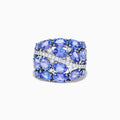 The 14K White Gold Tanzanite and Diamond Statement Ring features multiple oval blue-violet tanzanites and round white diamonds in an elegant, layered design.