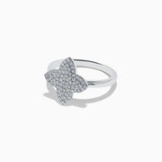 The Novelty 14K White Gold Diamond Clover Ring features a four-petal flower design adorned with diamonds, set in 14K white gold and shown on a plain white background.
