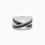 The 14K White Gold Black and White Diamond Crossover Ring features intersecting bands set with rectangular black and white diamonds, accented by rows of small clear stones for a striking crisscross effect.