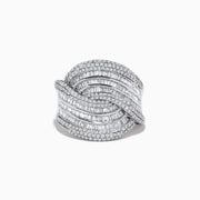 The 14K White Gold Diamond Statement Ring features overlapping, wavy rows of baguette and round diamonds, creating an elegant, textured design against a plain white background.