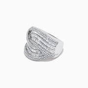 The 14K White Gold Diamond Statement Ring features overlapping, wavy rows of baguette and round diamonds, creating an elegant, textured design against a plain white background.