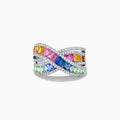 The Watercolors 14K White Gold Multi Sapphire and Diamond Crossover Ring features interwoven bands of pink, yellow, orange, blue, and green sapphires bordered by sparkling white diamonds on a white gold setting.