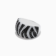 The 14k White Gold Black and White Diamond Zebra Print Ring features alternating rows of black and white diamonds in a bold zebra pattern, set in a polished white gold band against a plain white background.