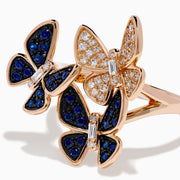 The 14K Rose Gold Diamond and Natural Sapphire Butterfly Ring showcases three butterflies—two accented with natural sapphires and one with diamonds—set on a plain rose gold band.