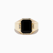 The Mens 14K Yellow Gold Onyx and Diamond Ring showcases a large rectangular onyx centerpiece framed by round diamonds, accented with two baguette-cut clear stones on each side.