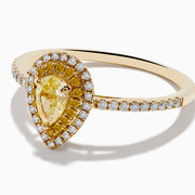 The Canare 14K Yellow Gold White and Yellow Diamond Ring features a pear-shaped yellow diamond with a white diamond halo and diamond-accented band, shown on a white background.