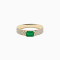 A 14K Yellow Gold Emerald and Diamond Ring featuring a rectangular emerald center with pavé-set diamonds along both sides of the band, displayed on a white background.