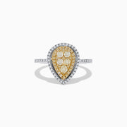 The Canare 14K Two Tone White and Yellow Diamond Ring showcases clustered yellow diamonds encircled by a double halo of white diamonds, set on a diamond-studded silver band for a striking, elegant look.
