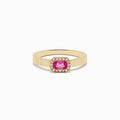 The 14K Yellow Gold Pink Sapphire and Diamond Ring features a ribbed gold band, a rectangular pink sapphire centerpiece, and a halo of white diamonds, shown on a white background.