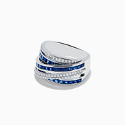 The Royale Bleu 14K White Gold Sapphire and Diamond Crossover Ring showcases alternating rows of square blue sapphires and white diamonds in a bold, layered design. Set on a plain white background.