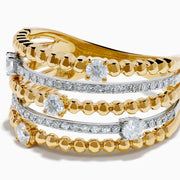 The 14K Two Tone Gold Diamond Beaded Multi Row Ring features four stacked bands with beaded textures and sparkling diamonds set in a symmetrical pattern.