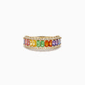 The Watercolors 14K Yellow Gold Multi Sapphire Baguette Band Ring showcases a row of rectangular rainbow sapphires, bordered by small round clear stones for a vibrant, elegant look.