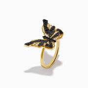 The Safari 14K Yellow Gold Black & White Diamond Butterfly Ring features a butterfly design with black and white diamonds segmented on its wings, set against a white background.