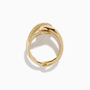 The D'Oro 14K Yellow Gold Diamond Interlocking Ring features a knot design, with one section accented by sparkling diamonds, beautifully displayed against a white background.