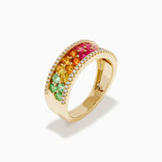The Watercolors 14K Yellow Gold Multi Sapphire and Diamond Band showcases a central rainbow gradient of sapphires bordered by two rows of white diamonds, set in yellow gold and displayed on a white background.
