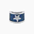 The Sterling Silver Blue Sapphire and Diamond Starfish Ring features a white starfish with clear crystals set among round blue sapphires atop a wide, curved band for a unique and stylish look.