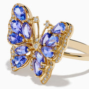 The Nahla 14K Yellow Gold Tanzanite and Diamond Butterfly Ring features blue tanzanite wings and diamond accents on the edges and body, shown against a white background.