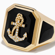 The Men's 14K Yellow Gold Onyx and Diamond Anchor Signet Ring features a black octagonal onyx face with a diamond-studded anchor at the center.