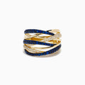 The 14K Yellow Gold Sapphire and Diamond Crossover Ring features multiple overlapping bands with alternating rows of sapphires and diamonds, creating a layered, intricate look.