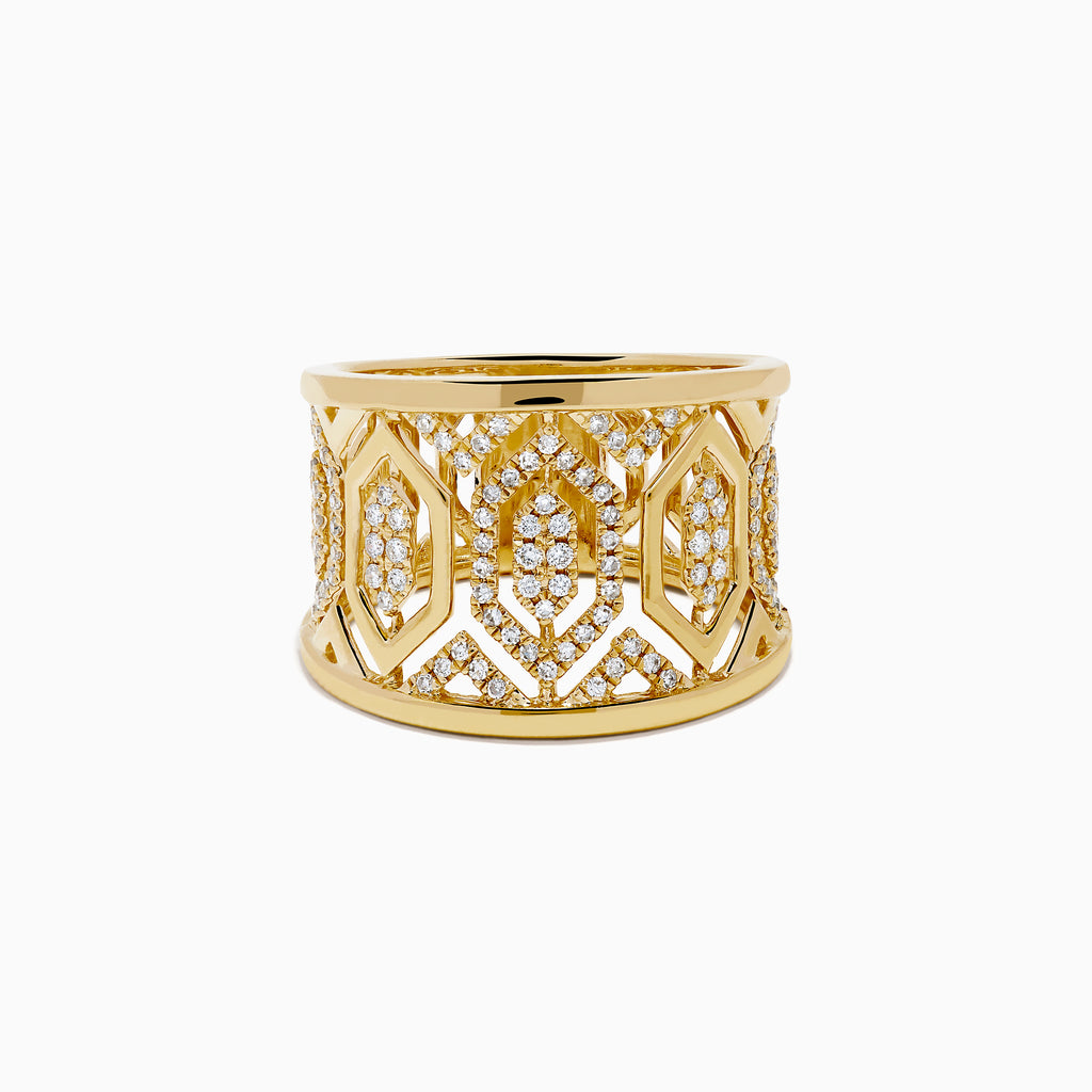 The D'Oro 14K Yellow Gold Geometric Diamond Ring features a wide band with intricate geometric patterns set with sparkling white diamonds, offering an ornate and luxurious look.