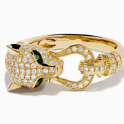 The Signature 14K Yellow Gold Diamond Panther Ring features a panther’s head with diamond accents, green gemstone eyes, black detailing, and a ring held in its mouth.