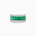 The 14K White Gold Emerald Baguette and Diamond Pavé Ring showcases a central row of emerald baguettes, flanked by rows of sparkling pavé diamonds on both sides.