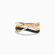 The 14K Yellow Gold Black and White Diamond Crossover Ring features three intertwined bands: a polished gold band, a black and white diamond band, and a clear diamond wave-patterned band.