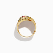 The 14K Yellow Gold Ruby and Diamond Crossover Ring showcases interwoven rows of rectangular red rubies and round white diamonds in a wavy, braided design across the band.
