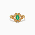 The 14K Yellow Gold Emerald and Diamond Filigree Halo Ring showcases a central oval green emerald, surrounded by a sparkling diamond halo and diamonds set along the split band.