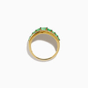 The 14K Yellow Gold Emerald and Diamond Wave Band features a central row of green emeralds bordered by two wavy rows of sparkling white diamonds in an elegant overlapping design.