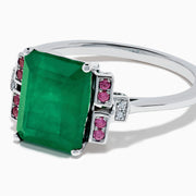The 14K White Gold Emerald, Pink Sapphire, and Diamond Ring features a vibrant green emerald accented by pink sapphires and diamonds in modern geometric settings for an elegant look.