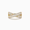 The D'Oro 14K Yellow Gold Diamond Criss Cross Ring showcases wide, polished bands crossed with baguette-cut diamonds and bordered by round diamonds for a dazzling look.