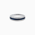 The 14K White Gold Pave Blue Sapphire and Diamond Band features a central row of blue sapphires bordered by sparkling diamonds, displayed on a plain white background.