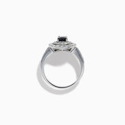 The Platinum GIA Certified Alexandrite and Diamond Double Halo Ring showcases an oval dark blue Alexandrite center stone, two rows of sparkling round diamonds in a double halo, and additional diamonds on the band, all set against a white background.