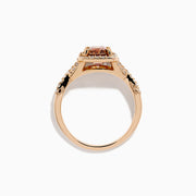 The Espresso 14K Rose Gold Brown Diamond Ring features a stunning brown diamond center with a halo of white diamonds and additional diamonds accenting its elegant twisted band.